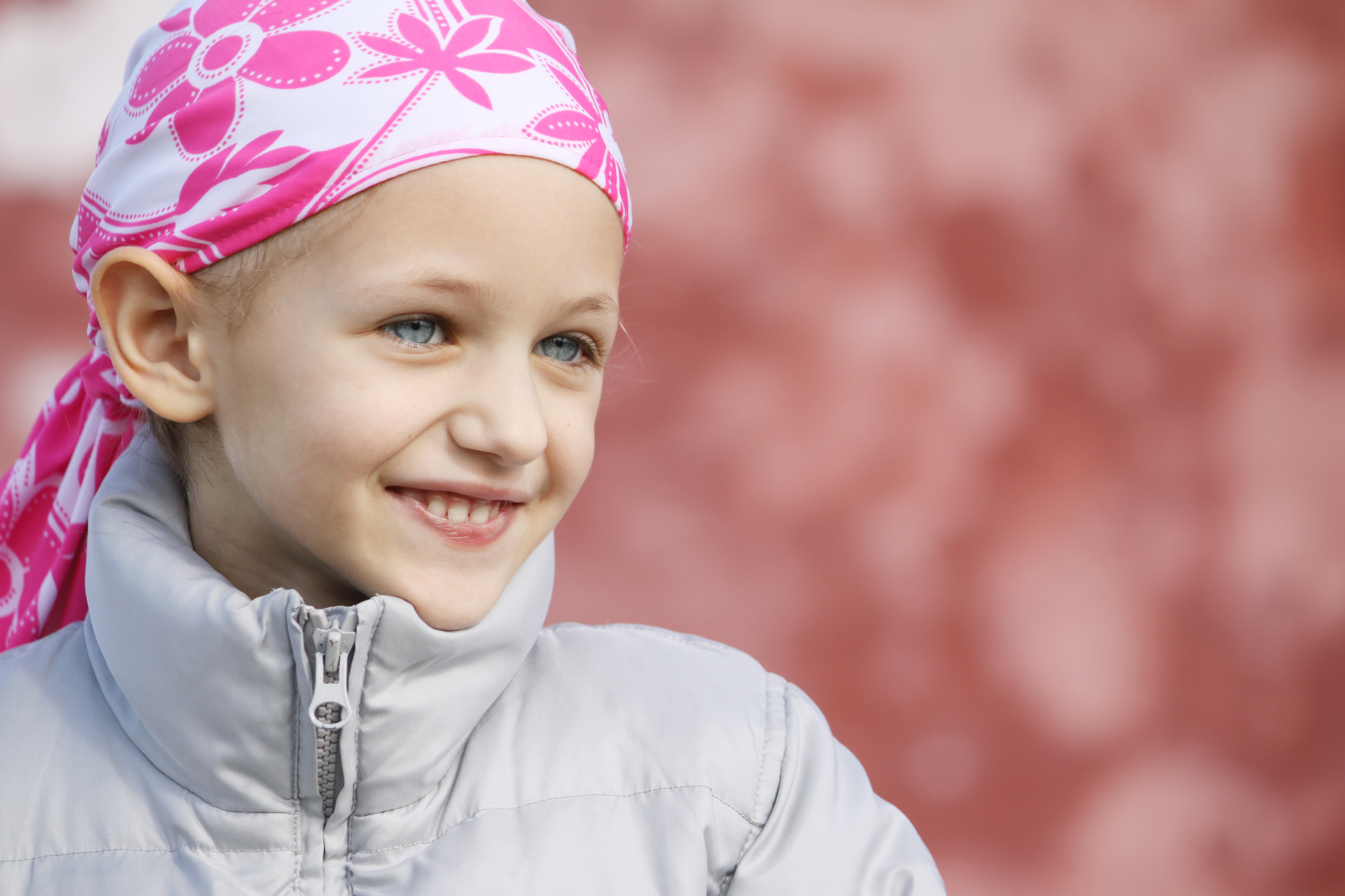 child wearing a head scarf as a result of hair loss due to chemotherapy